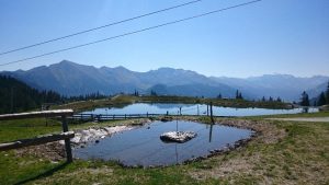 Water ponds with mountains in the background
